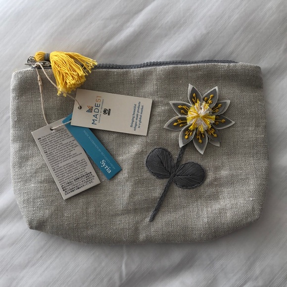 Made 51 crafted by refugees Handbags - NWT Made 51 crafted by refugees UNHCR sunflower pouch